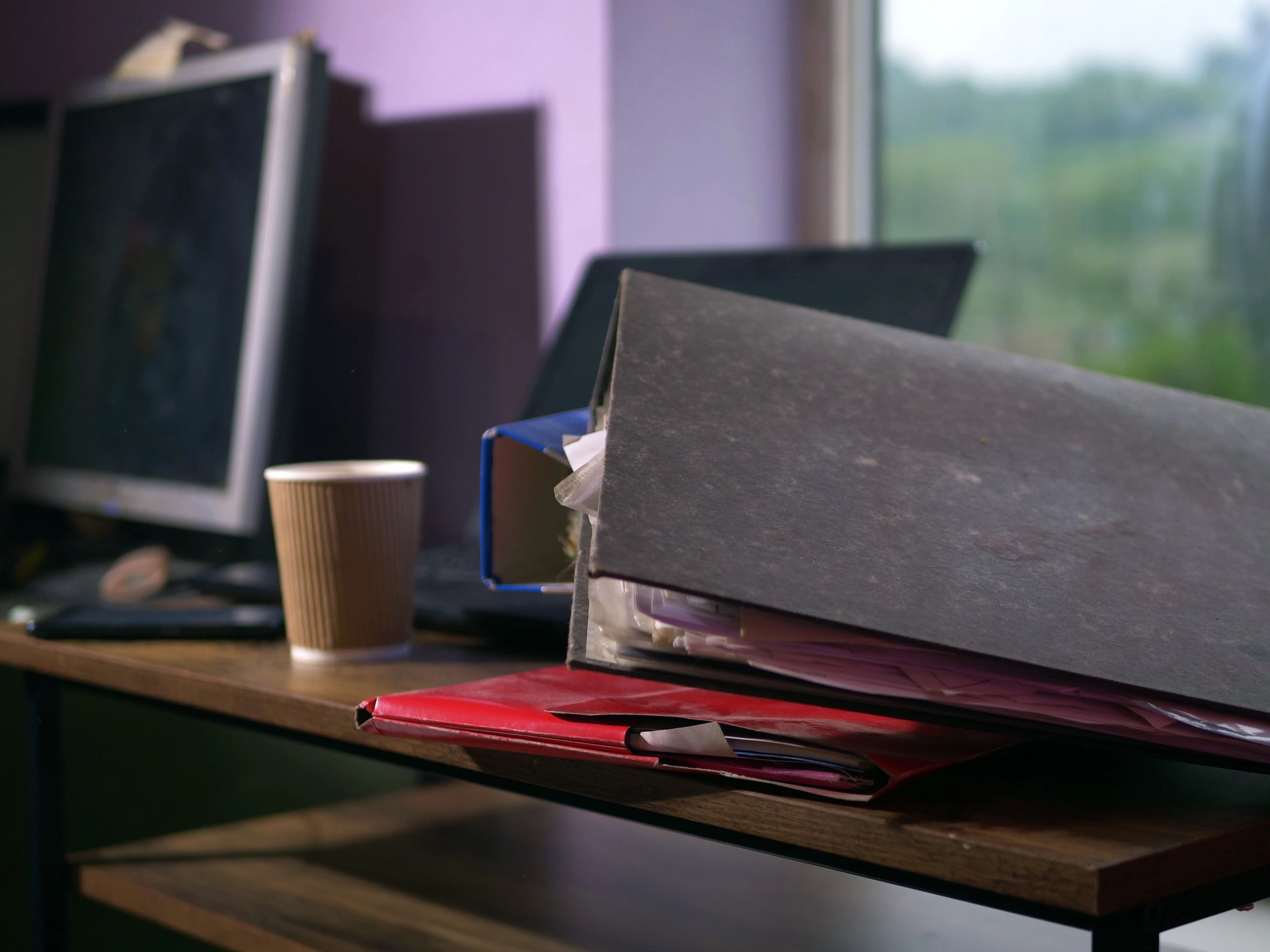 Office desk with folders and files representing document handling
